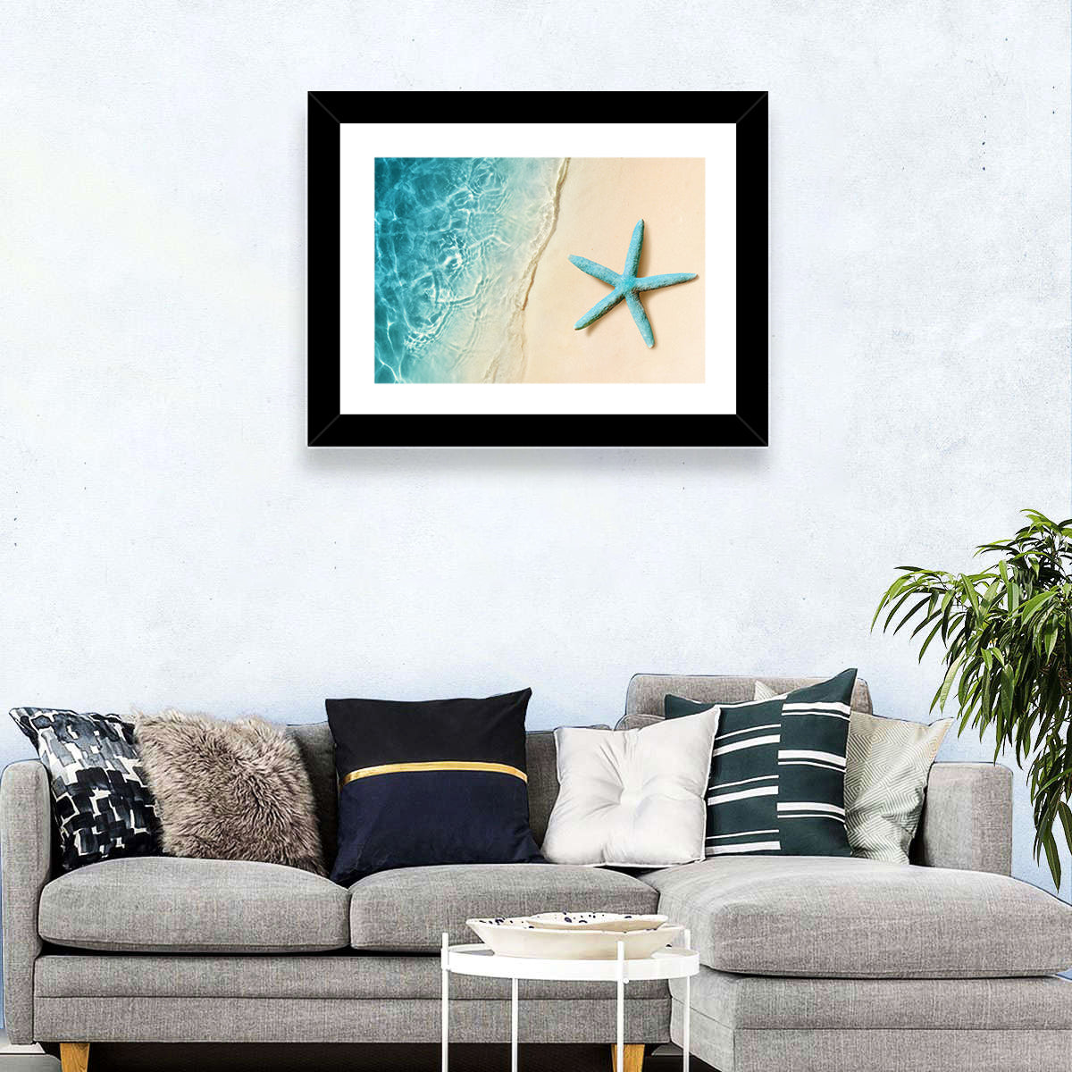Blue Starfish on Sandy Beach Wall Art in a room, landscape
