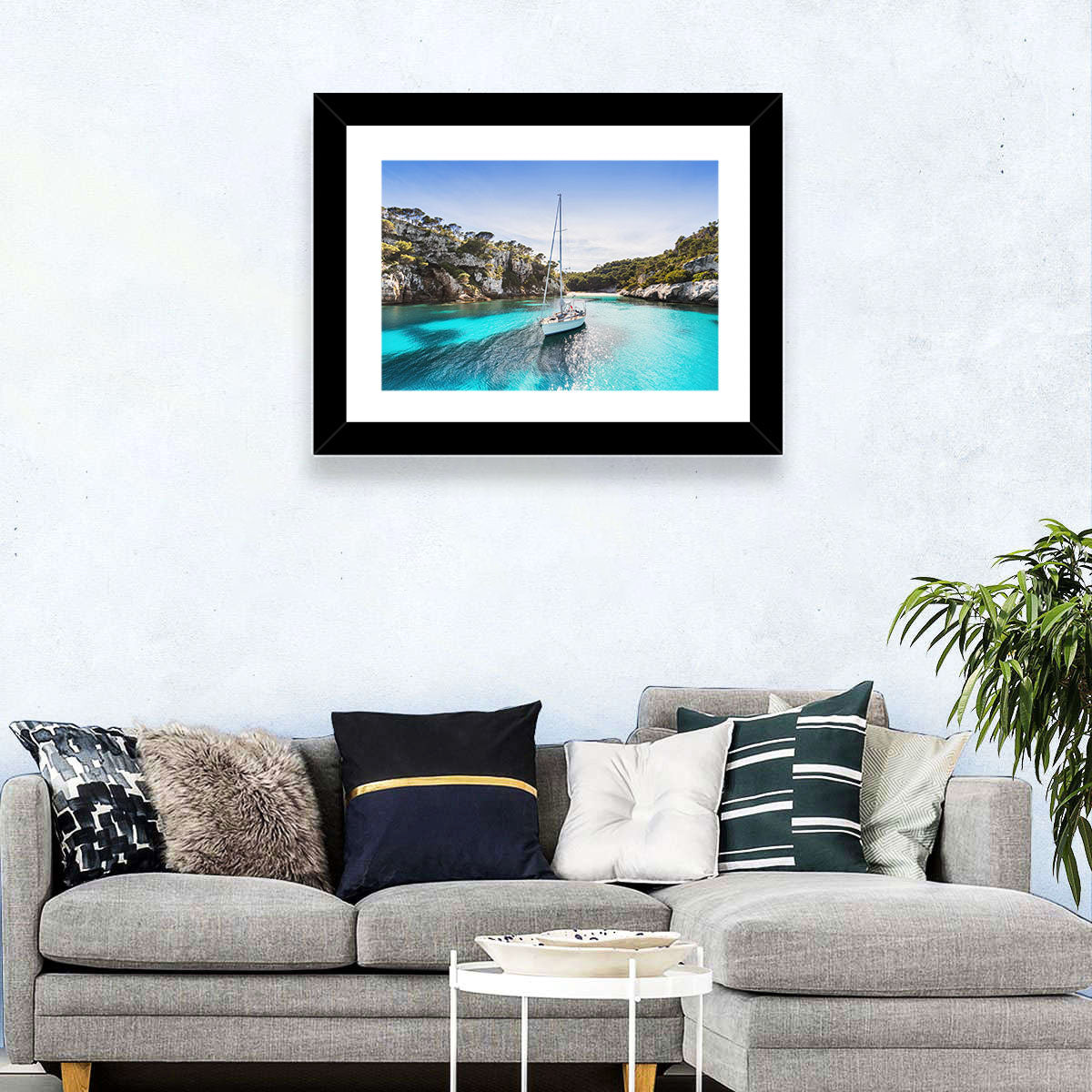 Menorca Cove Sailboat Wall Art in a room, landscape