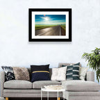 Sunlit Road Through Green Field Wall Art