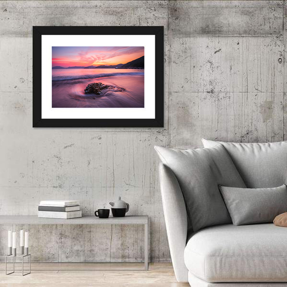Pink Sunset Over Rock and Pier Wall Art in a room, landscape