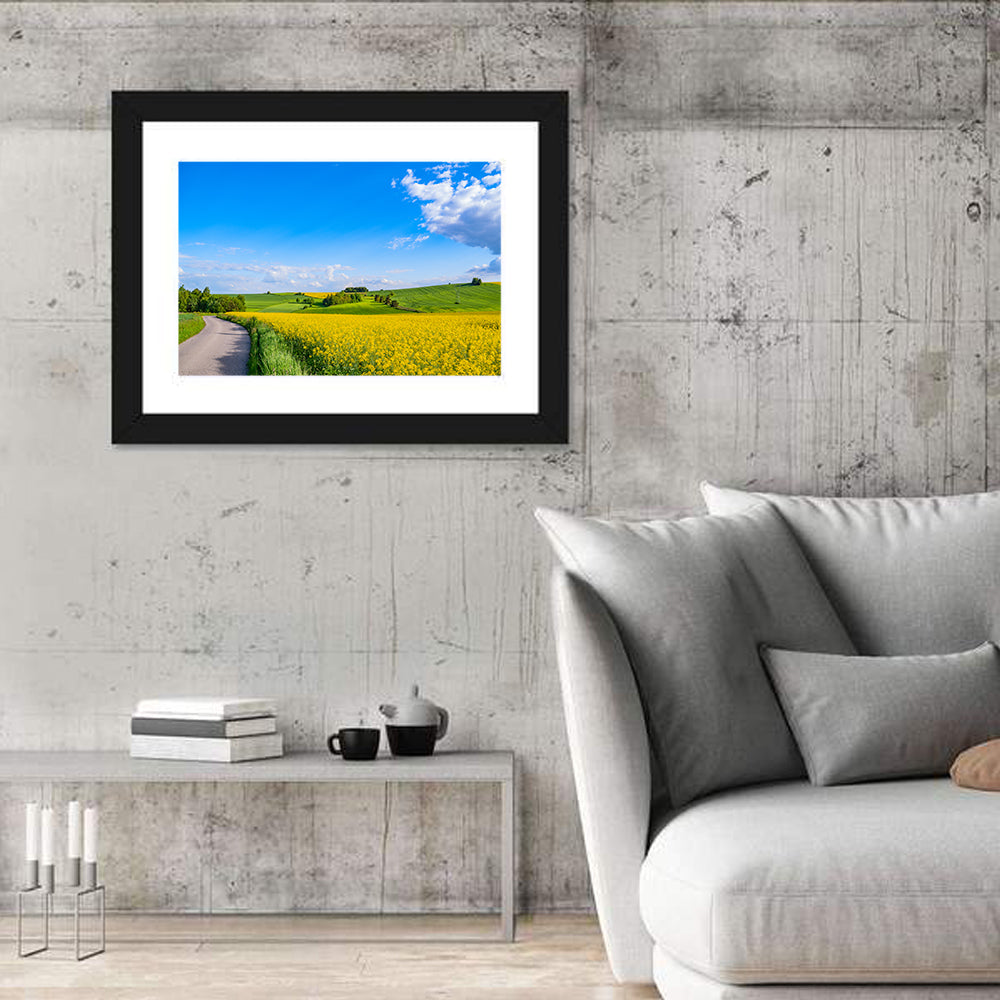 Rapeseed Field Road Under Blue Sky Wall Art in a room, landscape