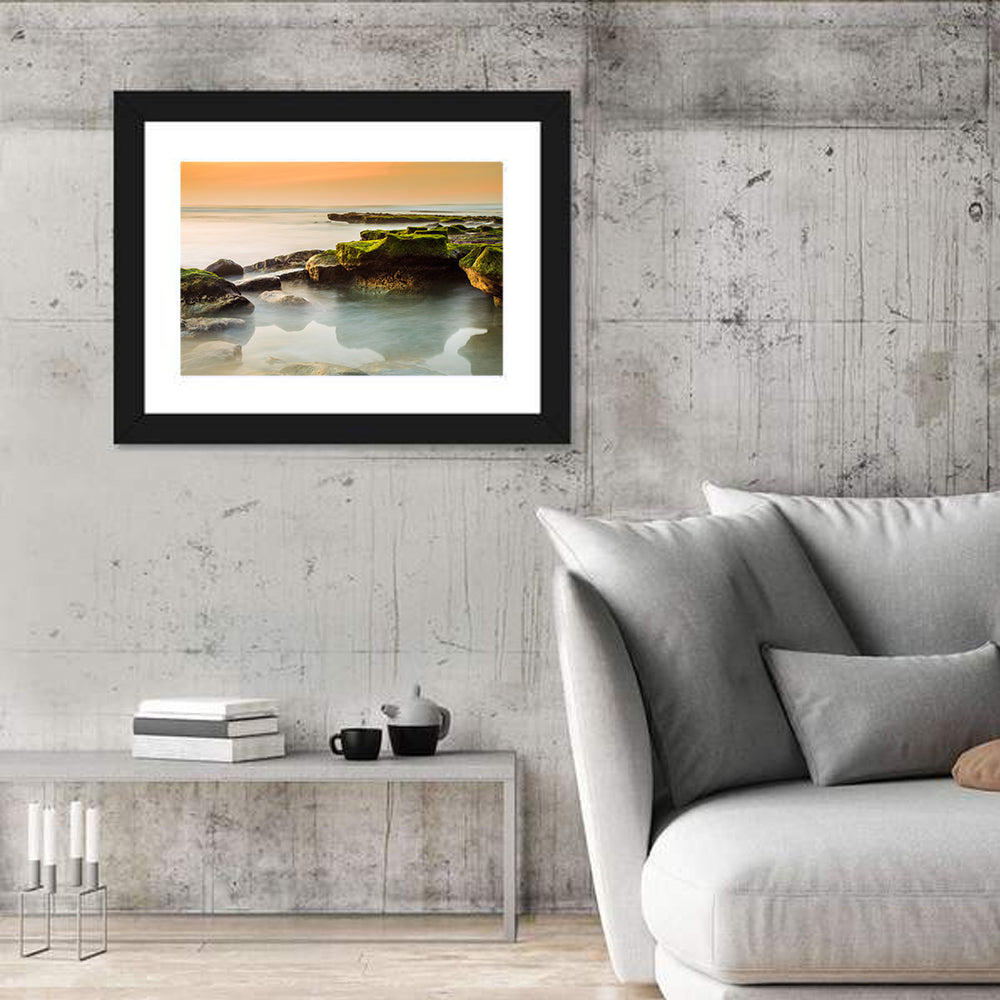 Mossy Rocky Coastline at Golden Hour Wall Art in a room, landscape