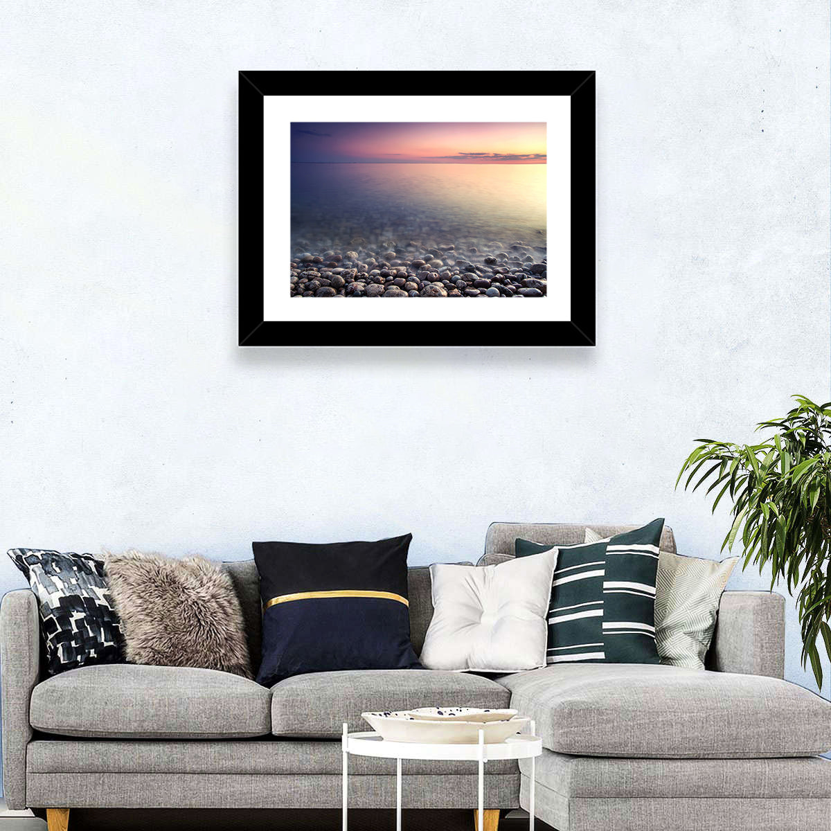 Pebbled Shore Sunset Wall Art in a room, landscape