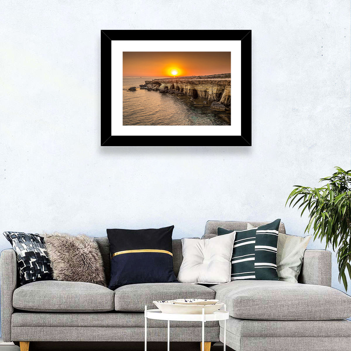 Sunset Over Sea Caves Wall Art in a room, landscape