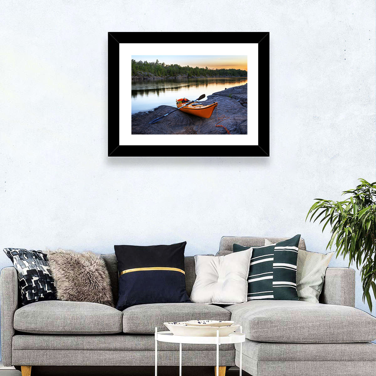 Orange Kayak on Rocky Shore Wall Art in a room, landscape