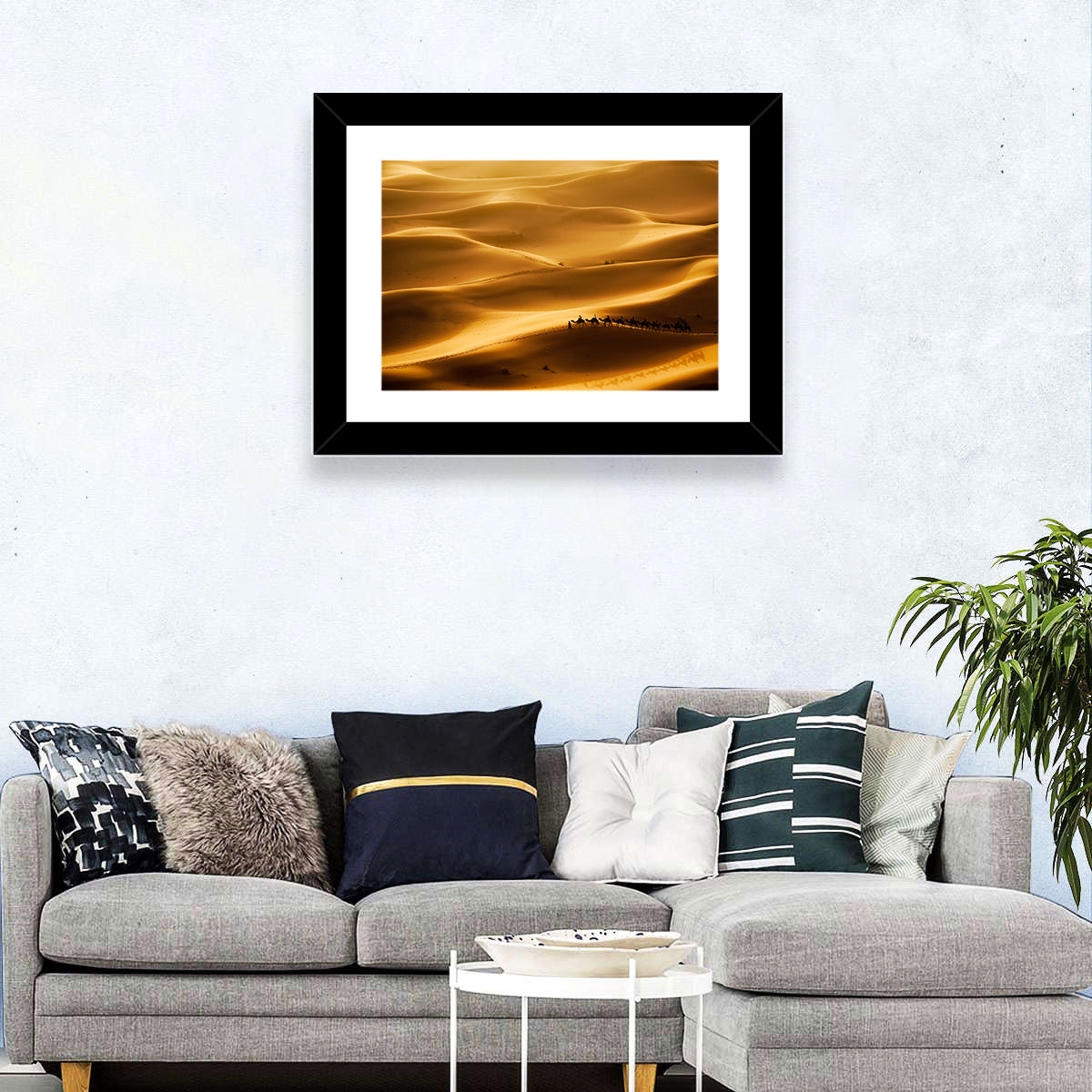 Golden Hour Camel Caravan Wall Art in a room, landscape