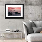 Pink Dusk Lakeshore with Silhouetted Rocks Wall Art