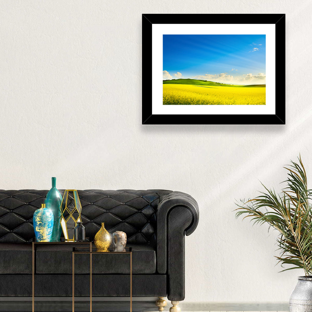 Rapeseed Field and Rolling Hills Under Blue Sky Wall Art