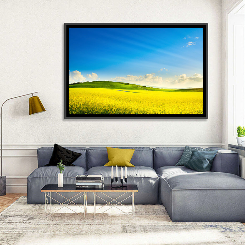 Rapeseed Field and Rolling Hills Under Blue Sky Wall Art