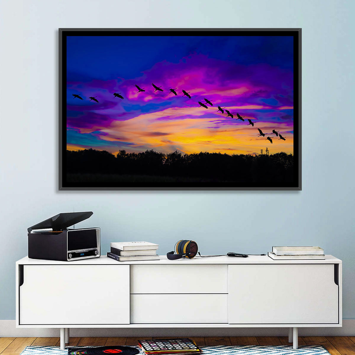 Silhouetted Cranes at Dusk Wall Art in a room, landscape