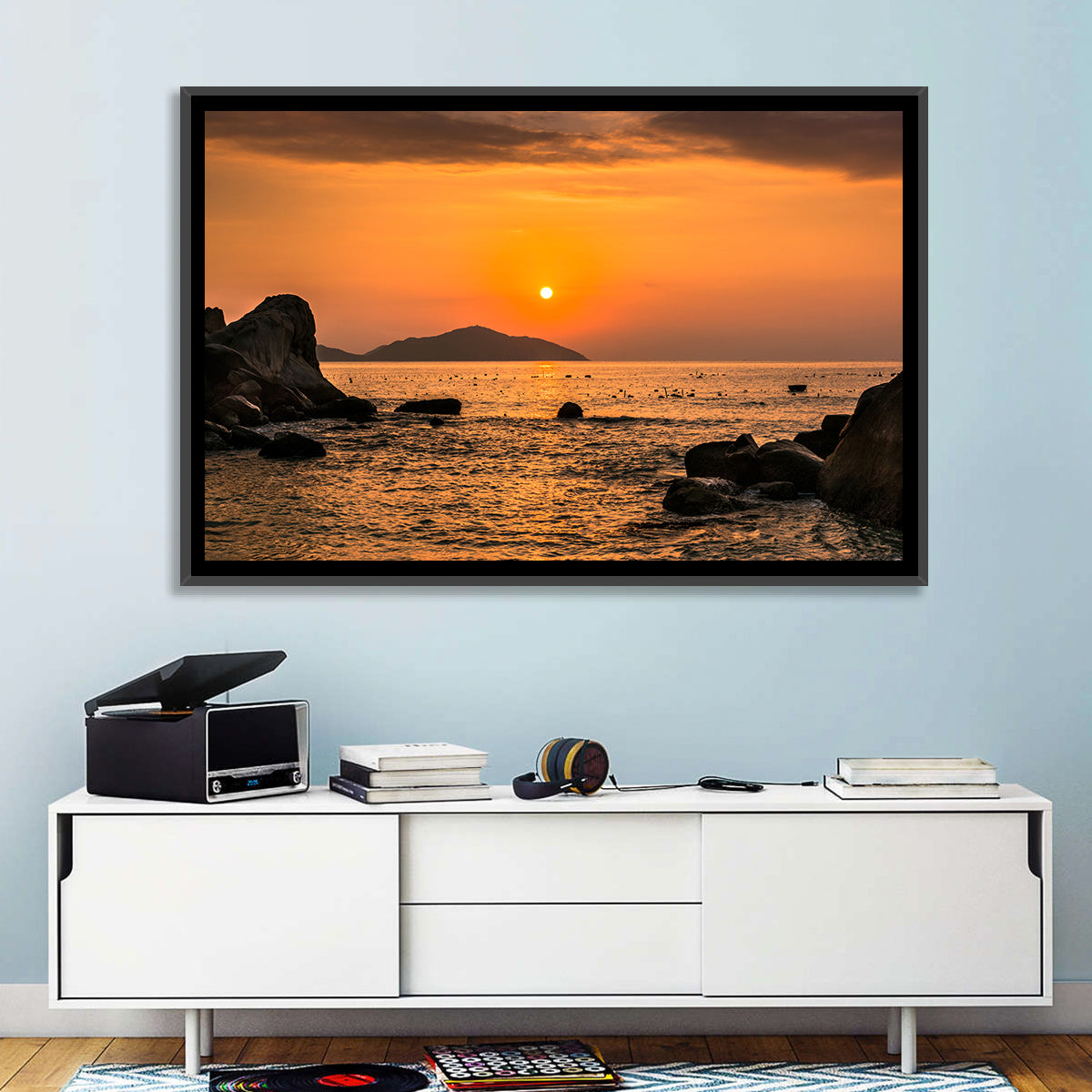 Orange Sunrise Over Rocky Coast Wall Art in a room, landscape