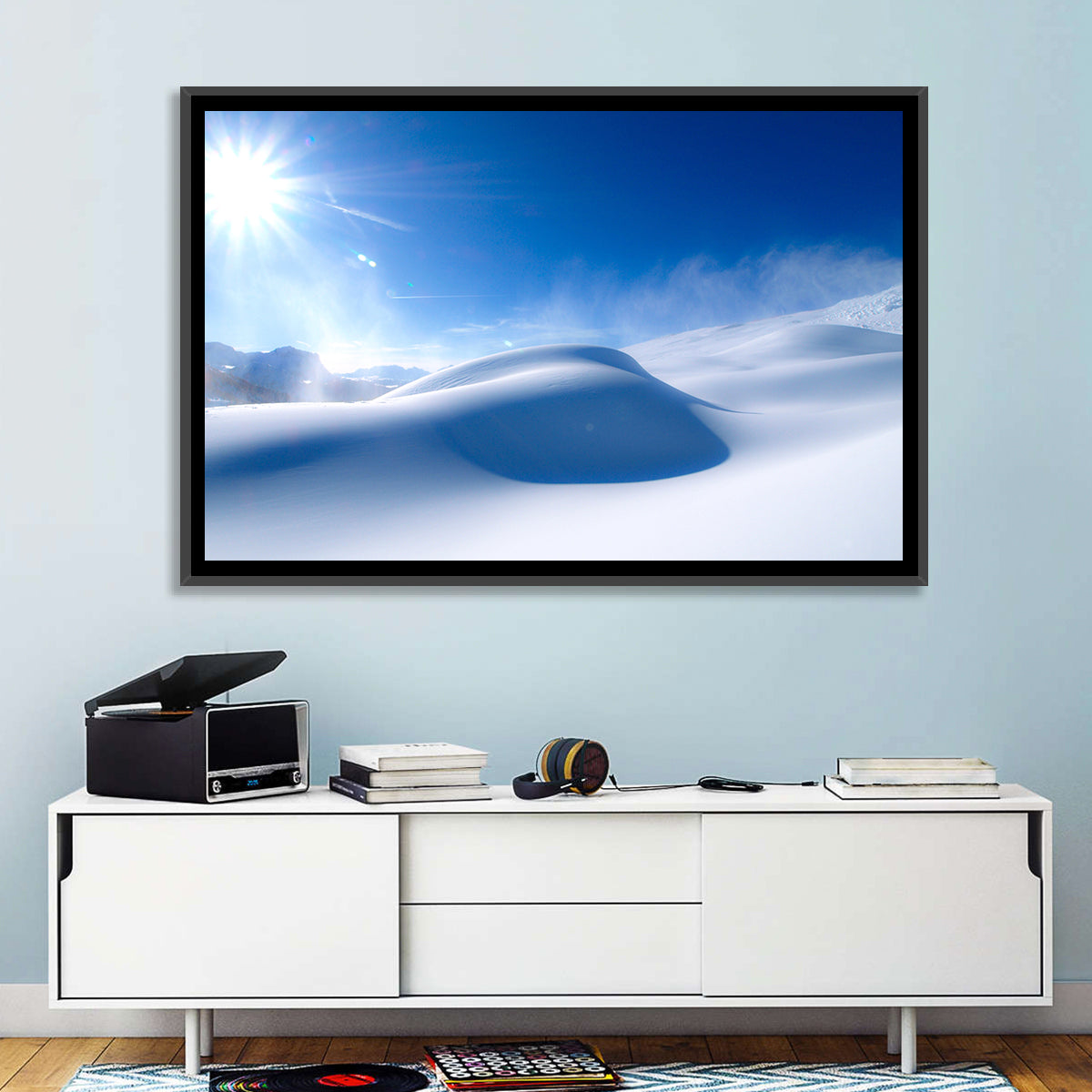 Sunlit Snow Dune Under Blue Sky Wall Art in a room, landscape