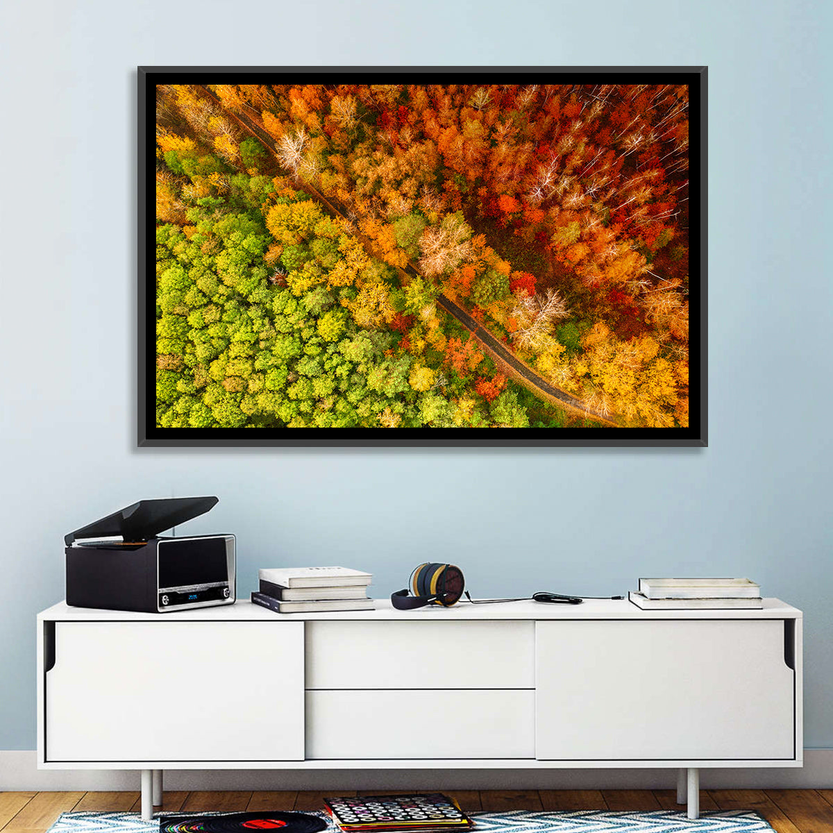 Winding Road Through Autumn Forest Wall Art in a room, landscape