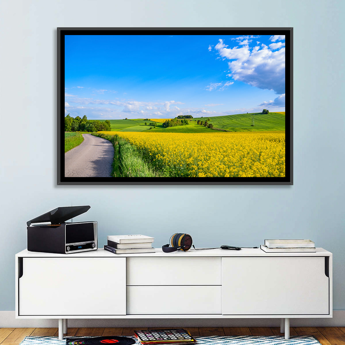 Rapeseed Field Road Under Blue Sky Wall Art in a room, landscape