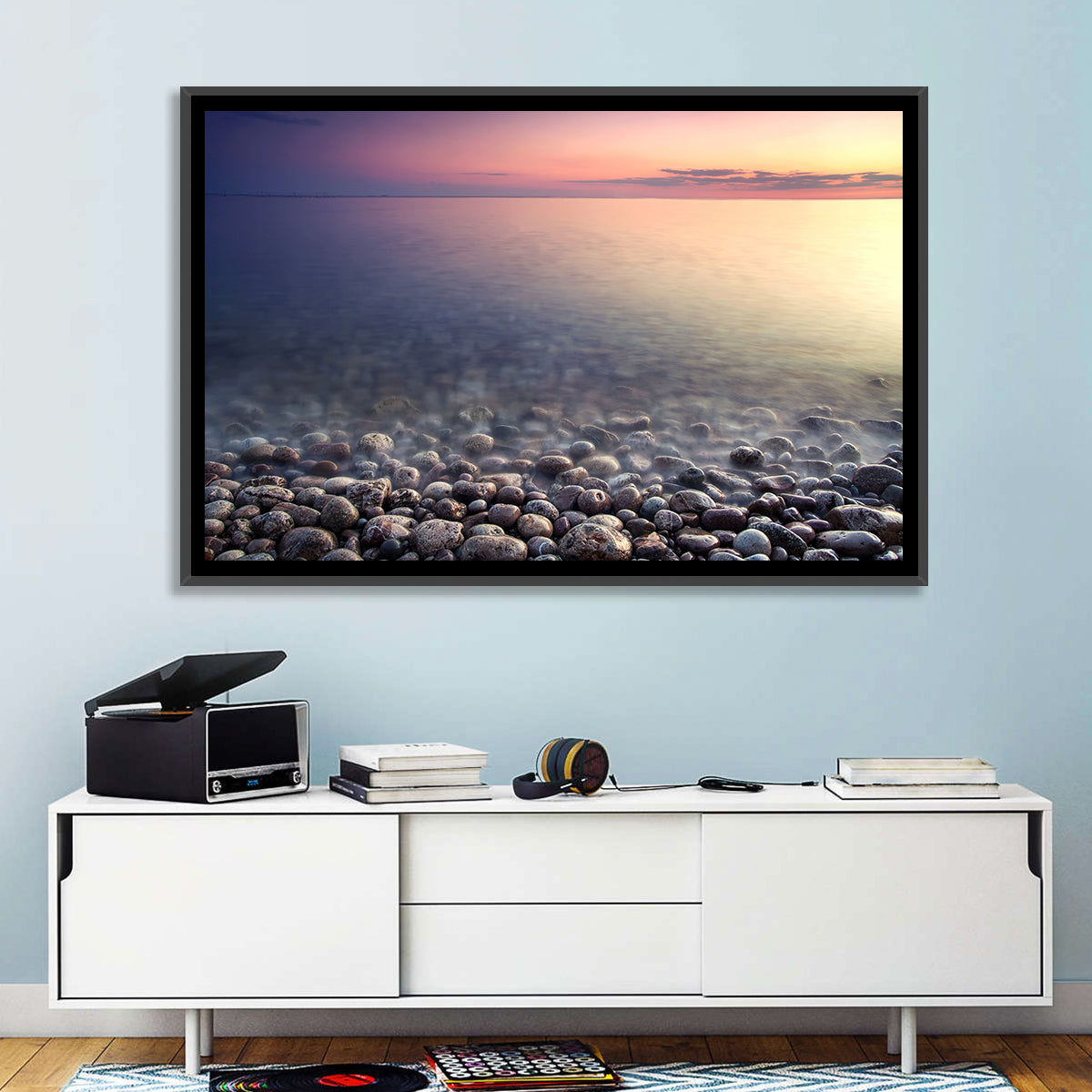 Pebbled Shore Sunset Wall Art in a room, landscape