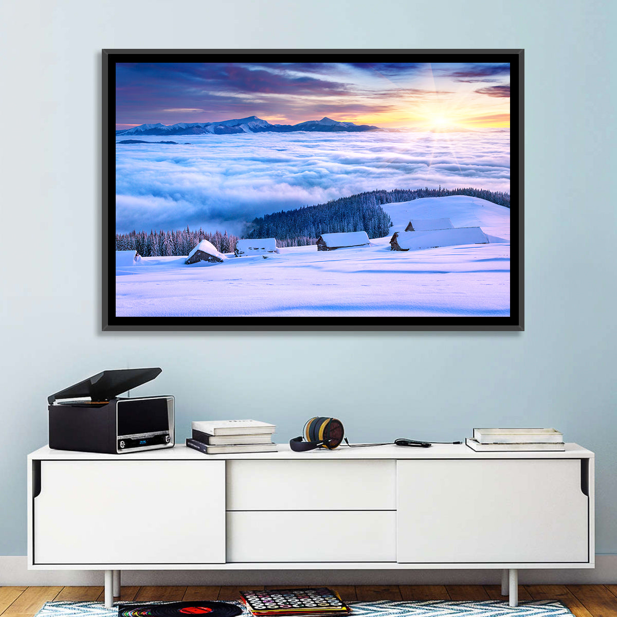 Snowy Cabins Above Clouds Wall Art in a room, landscape