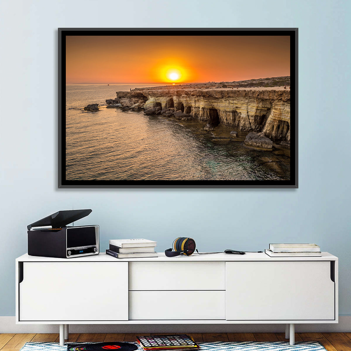 Sunset Over Sea Caves Wall Art in a room, landscape