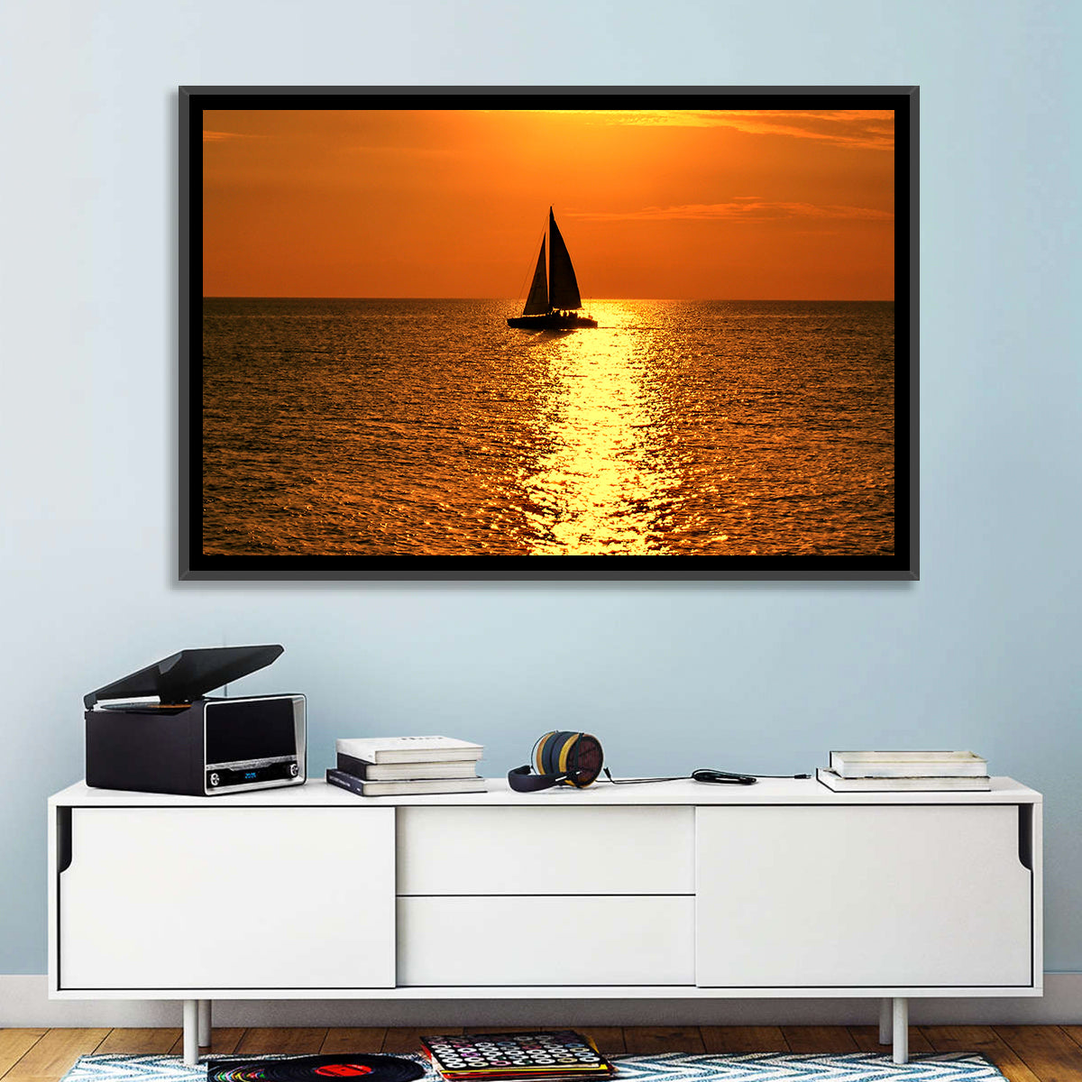 Sailboat Silhouette at Golden Sunset Wall Art in a room, landscape