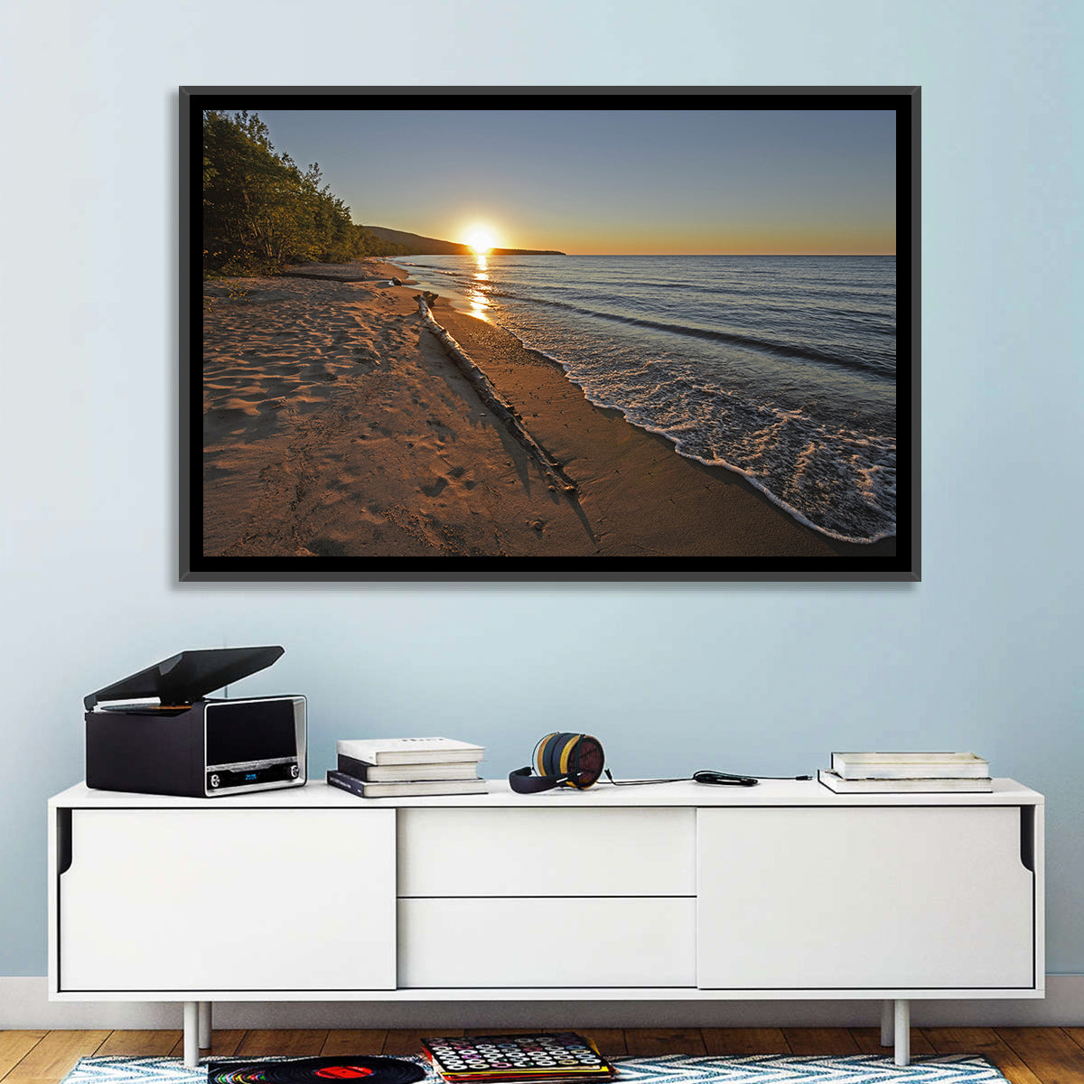 Lake Superior Driftwood Beach Sunset Wall Art in a room, landscape