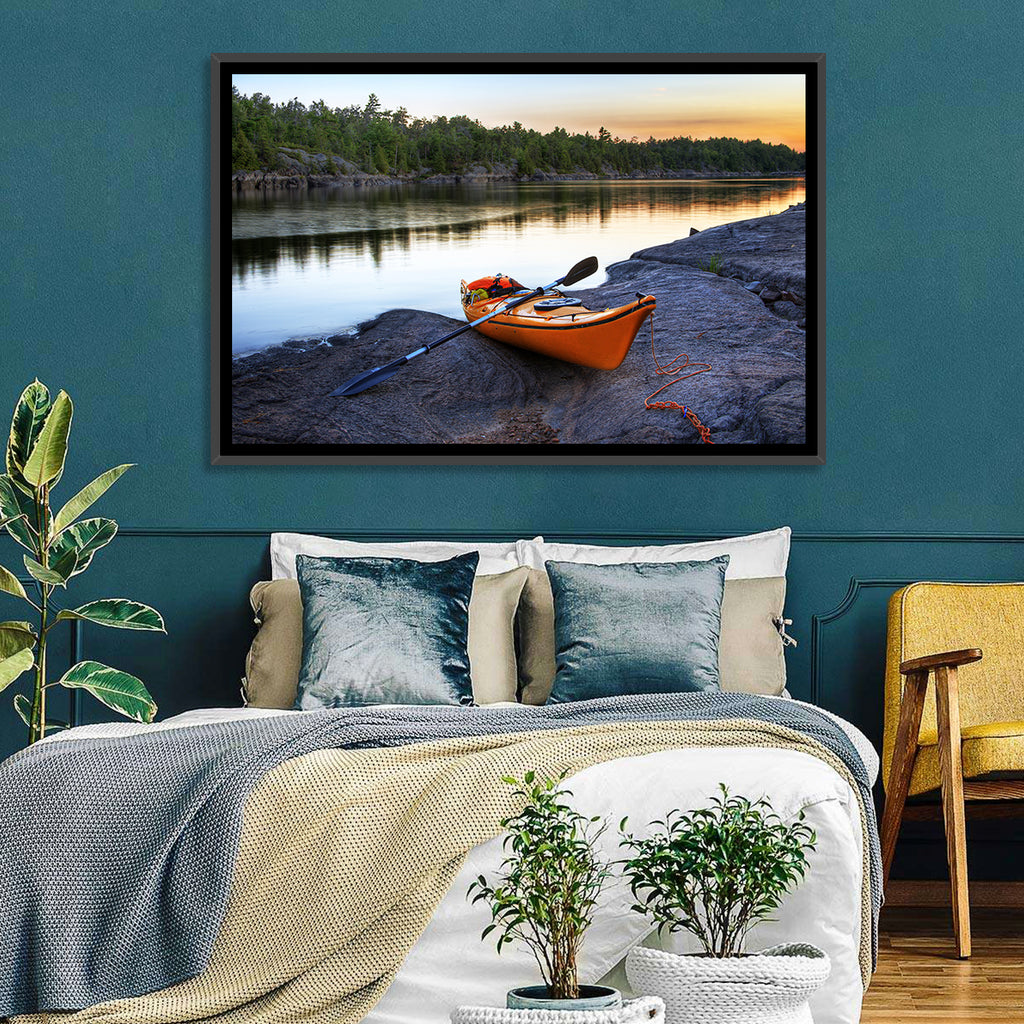 Orange Kayak on Rocky Shore Wall Art