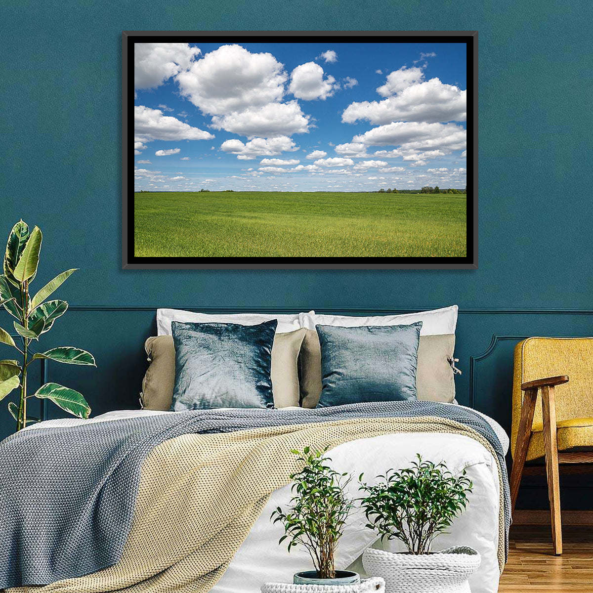 Cloud Filled Sky Over Meadow Wall Art in a room, landscape