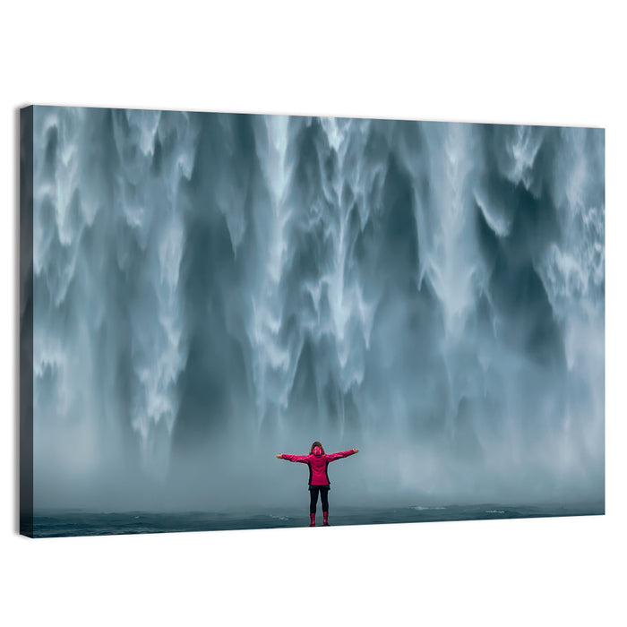 Skogafoss Waterfall with Figure in Pink Wall Art as a canvas print