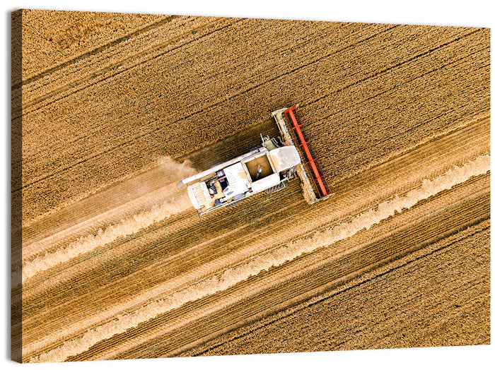 Aerial Combine Over Wheat Field Wall Art as a canvas print