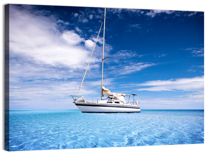 Furled Sails Over Turquoise Water Wall Art as a canvas print