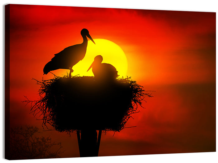 Storks in Nest at Sunset Wall Art as a canvas print