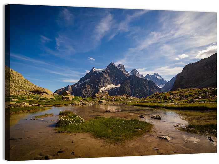 La Meije Alpine Lake and Stone Hut Wall Art as a canvas print
