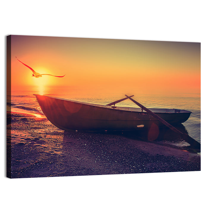 Sunset Rowboat on Sandy Shore Wall Art as a canvas print