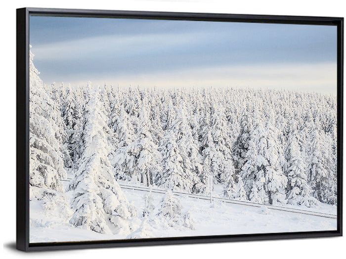 Snowy Forest Railway Tracks Wall Art as a framed canvas