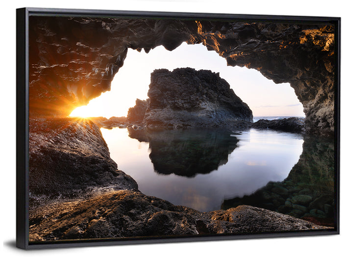 Sea Cave Sunset Wall Art as a framed canvas