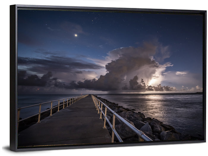 Storm Clouds Over Pier Wall Art as a framed canvas