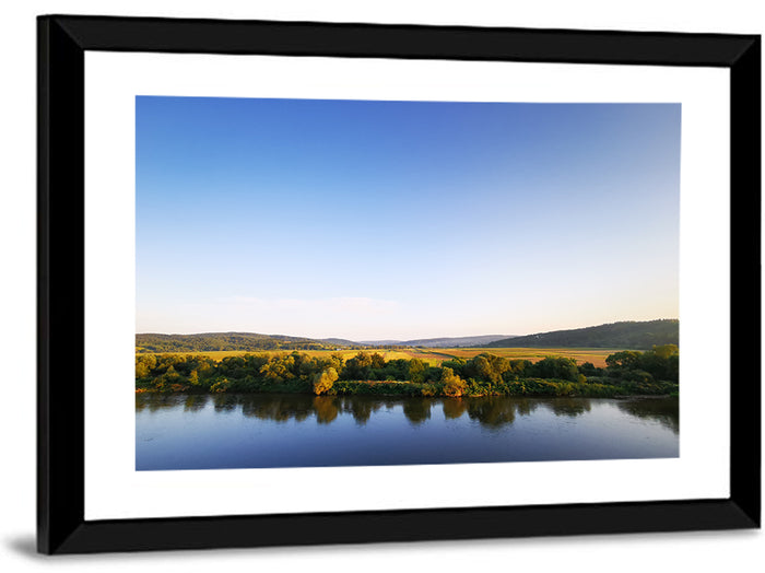 Peaceful River Sunset Wall Art as a framed print