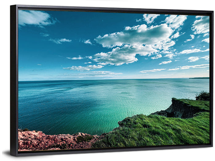 Coastal Cliffs Above a Turquoise Sea Wall Art as a framed canvas