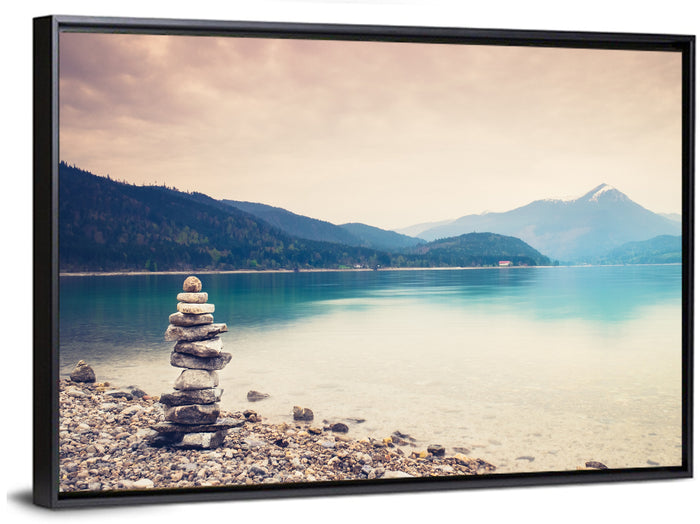 Stone Cairn by a Mountain Lake Wall Art as a framed canvas