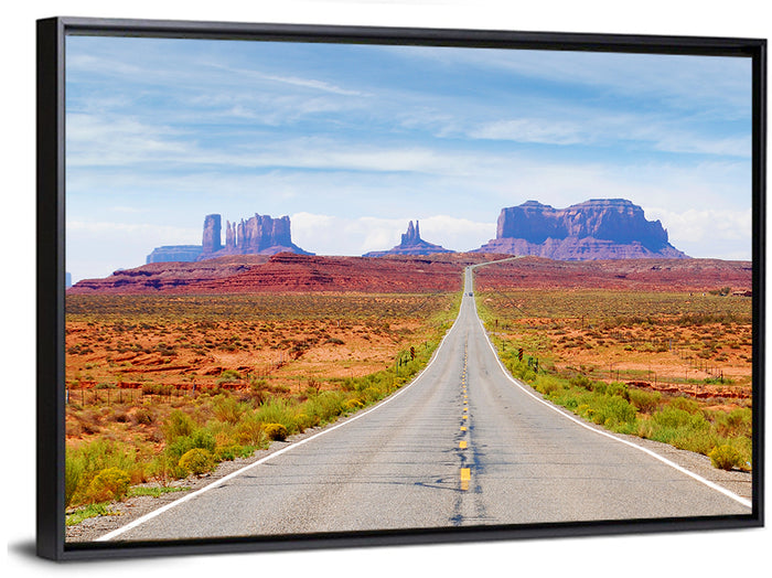 Highway 163 Into Monument Valley Wall Art as a framed canvas
