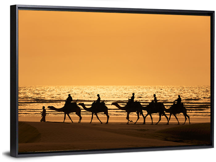 Camel Caravan Silhouette on Wet Sand Wall Art as a framed canvas