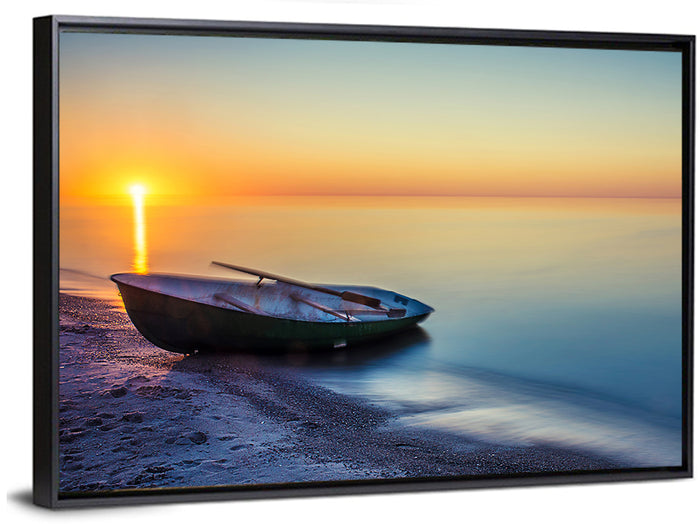 Rowboat Sunrise Seascape Wall Art as a framed canvas