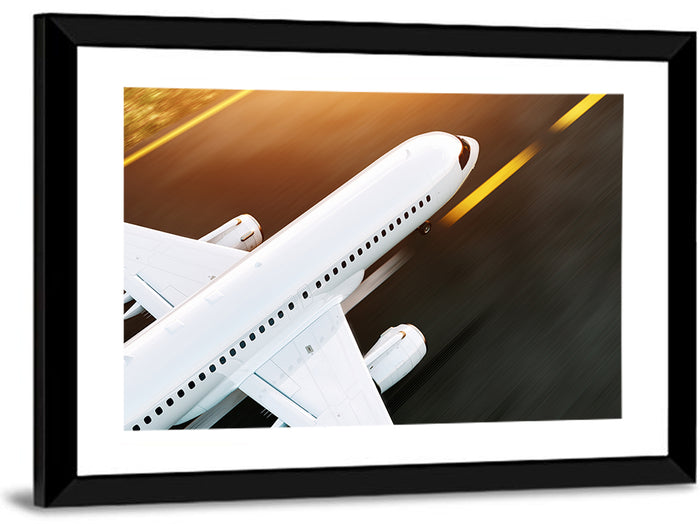 Commercial Jet Takeoff at Sunset Wall Art as a framed print
