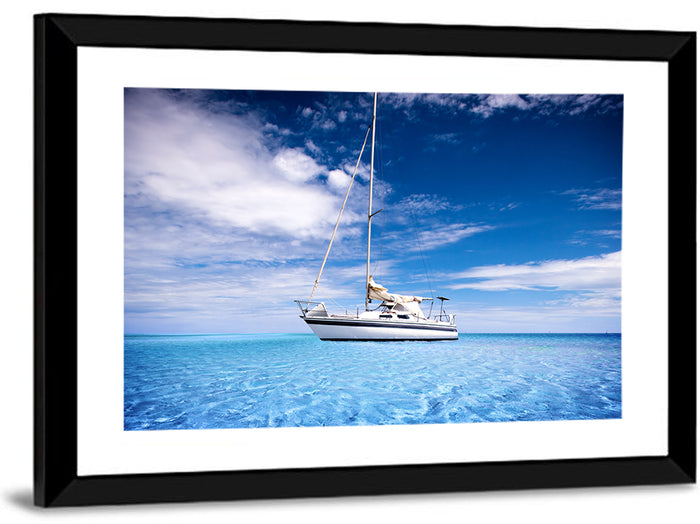 Furled Sails Over Turquoise Water Wall Art as a framed print