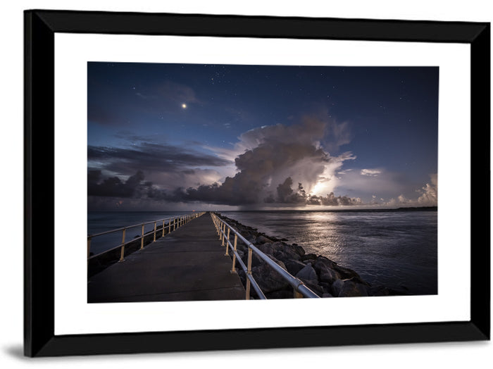 Storm Clouds Over Pier Wall Art as a framed print