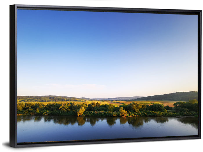 Peaceful River Sunset Wall Art as a framed canvas