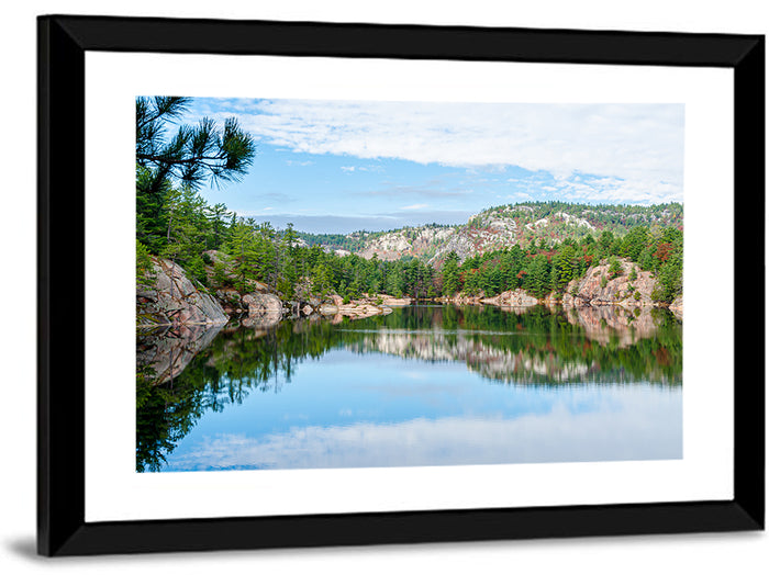 Mirror-quiet Lake and Pines Wall Art as a framed print