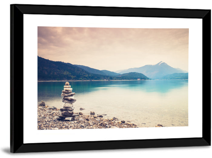 Stone Cairn by a Mountain Lake Wall Art as a framed print