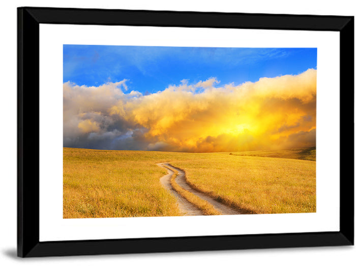 Sunlit Meadow Path with Dramatic Clouds Wall Art as a framed print