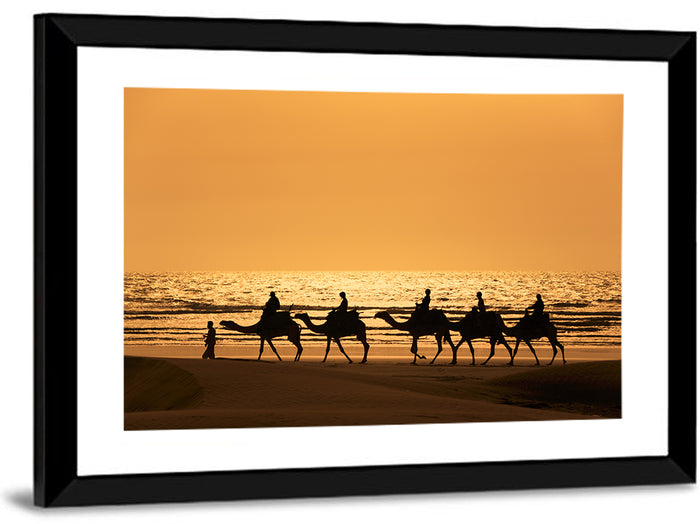 Camel Caravan Silhouette on Wet Sand Wall Art as a framed print