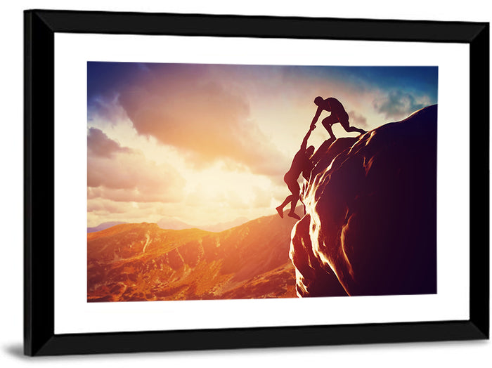 Two Hikers Summit Assist at Sunset Wall Art as a framed print