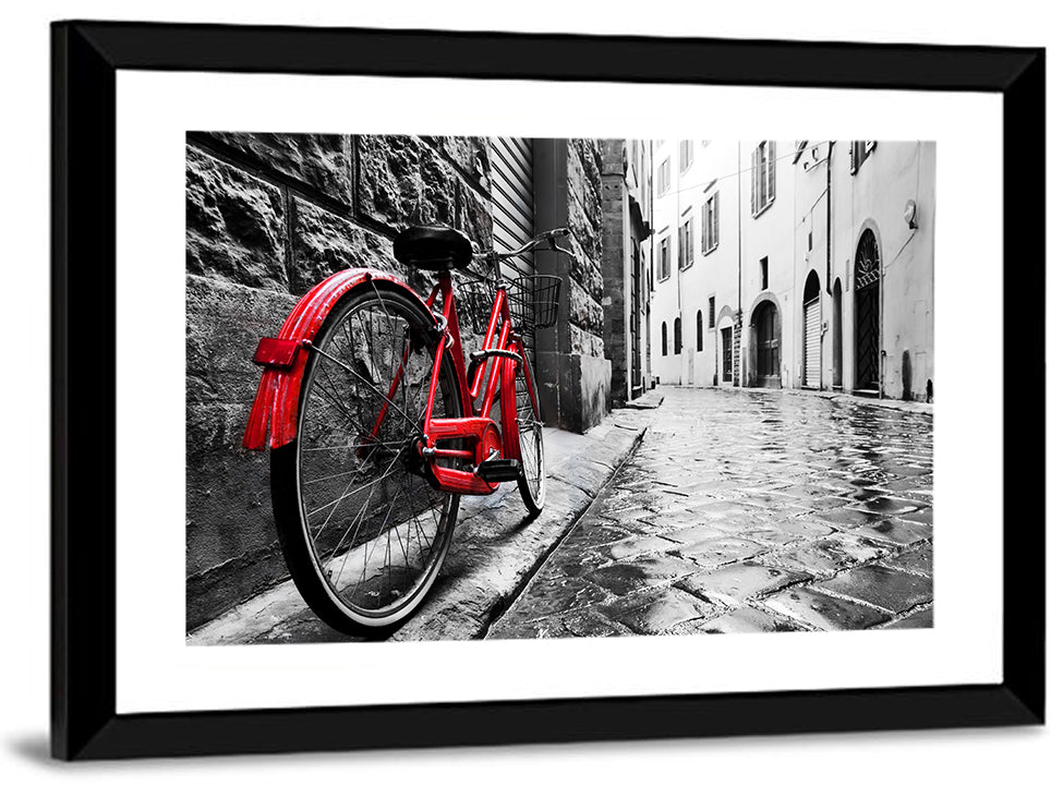 Red Bicycle on Rainy Cobblestone Street Wall Art